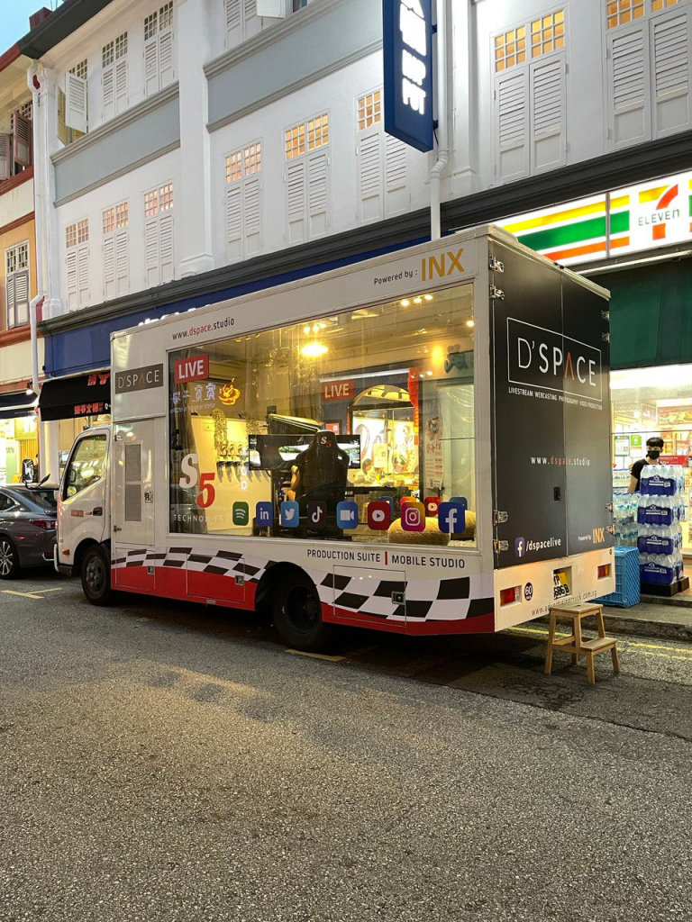 mobile simulator racing truck in singapore. race in the eracing virtual world while on the road in a physical simulator truck event in singapore